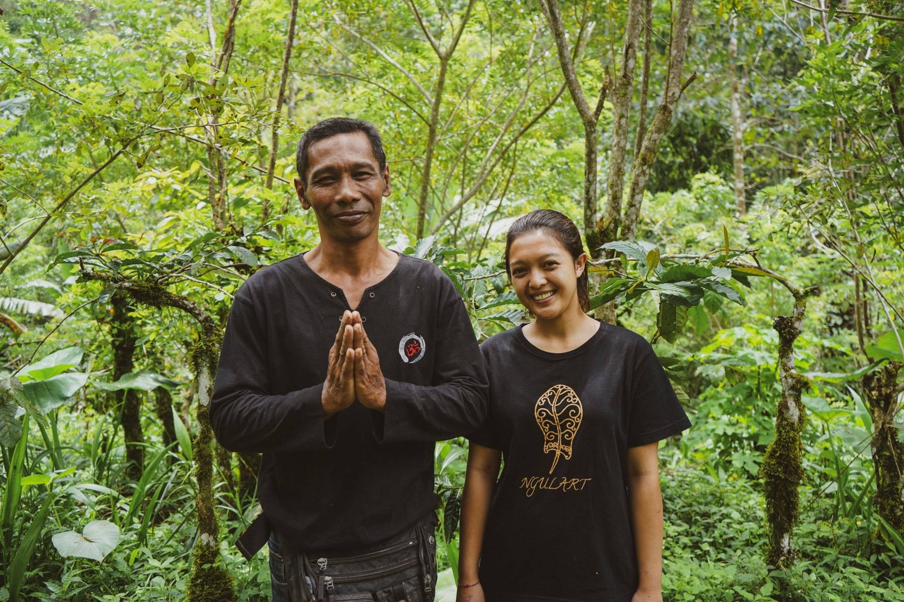 Two hosts welcoming pilgrims to their land with hands together